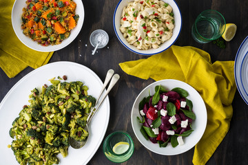 Salad Bar with Bowls of various salads  on wooden table 