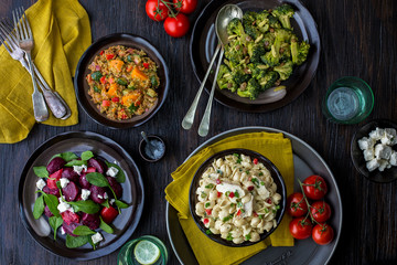 Salad Bar with Bowls of various salads  on wooden table 