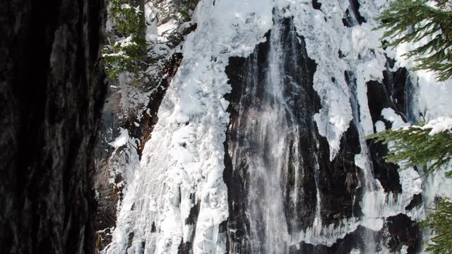 Dolly Reveal of Narada Falls Snowy Waterfall in Mt Rainier National Park