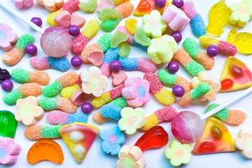 Many colorful lollipops with a sweet flavor placed on the plate.