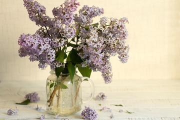 bunch of  lilac flowers in a glass vase