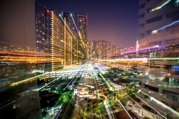 Fototapeta na wymiar Blurred abstract background of light lines from the capital's residences in condominiums,offices, street lights from shopping malls, nighttime beauty
