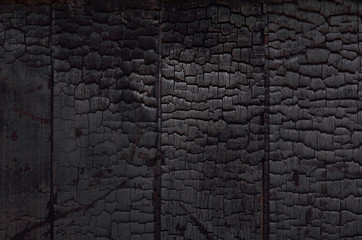 Burned wood texture. Black grunge background