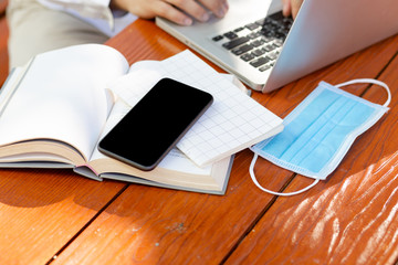 Wear a protective mask to prevent disease,young asian business man, work from home,In the back of the house to be happy