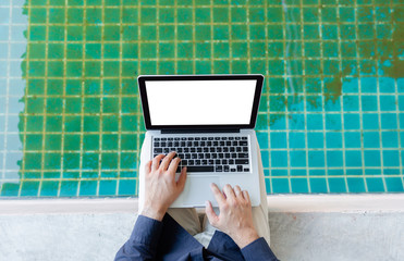 hand close up young asia business man, Happy young man working on laptop,at his working from home,Mock up copy space,Beside the pool