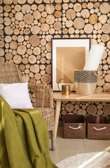 Interior of modern room with wicker armchair and table