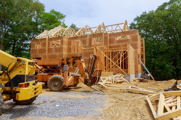 Fototapeta premium American residential beams of home in mid construction