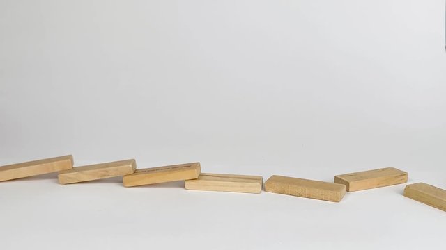 Jenga Blocks stacked for a Domino Chain Reaction in Slow Motion