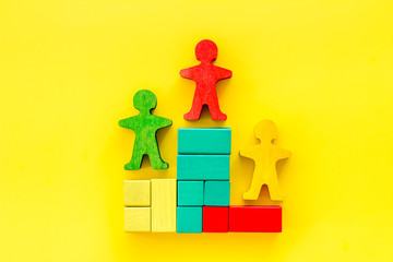 Winners podium. Figures of humans on yellow background top view