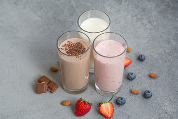 Assorted protein cocktails with fresh fruits, berries and chocolate. Protein shake. Sports...