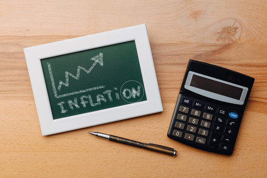 charts of economics and stock markets on a chalk board. financial crisis concept.