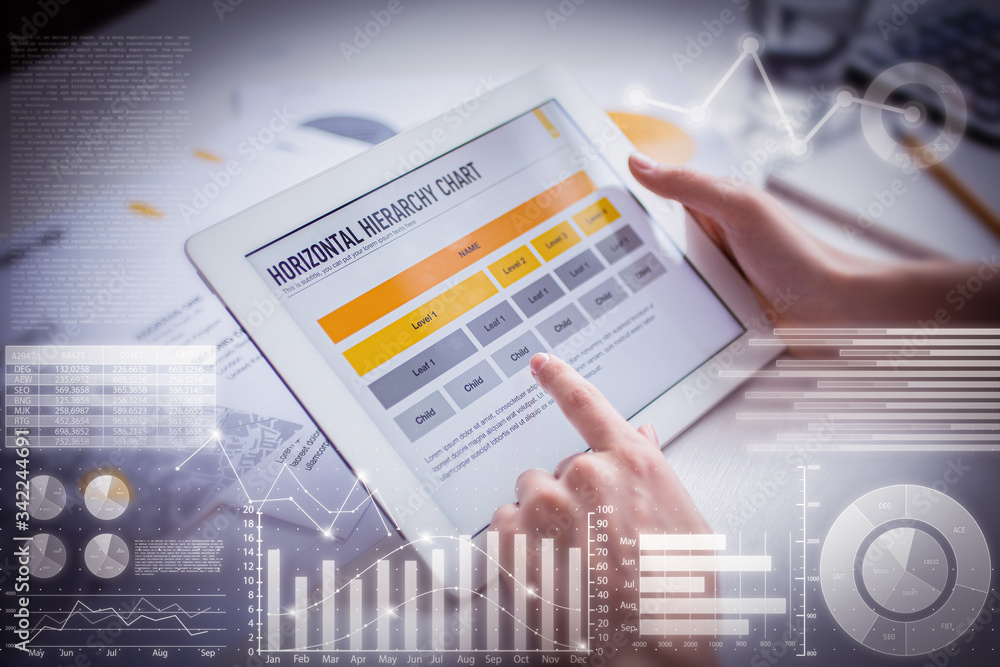 Poster woman examining chart on tablet with virtual statistic graphics. unrecognizable businesswoman sittin