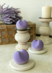 Obraz na płótnie Canvas French Mousse Mini Desserts with Purple Velvet Cover