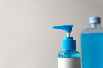 Closeup Chemical blue Isopropyl alcohol (Ethanol or ethyl alcohol) liquid in a plastic press pump head blue bottle with blank label for medical and prevent from germs, bacterial,coronavirus COVID-19.