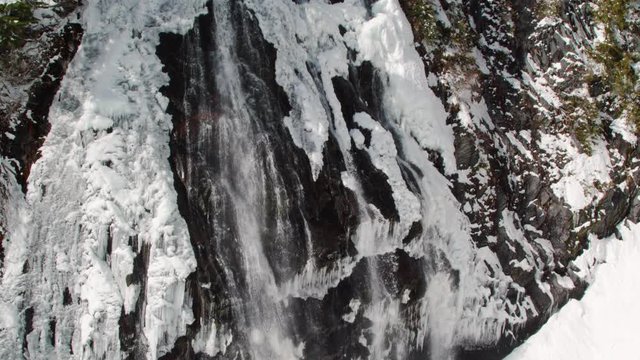 Majestic Waterfall in Mt Rainier National Falls with Winter Snow Melt