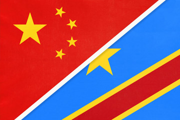 China or PRC vs Congo national flag from textile. Relationship between Asian and African countries.