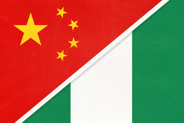 China or PRC vs Nigeria national flag from textile. Relationship between Asian and African countries.