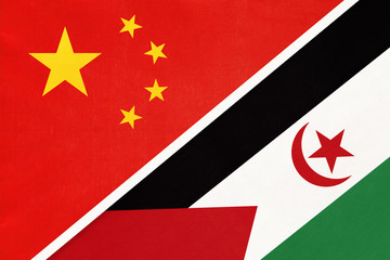 China or PRC vs Sahrawi Arab Democratic Republic national flag from textile. Relationship between countries.