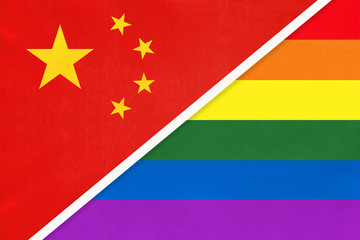 China national fabric flag vs rainbow flag of LGBT community from textile opposite each other