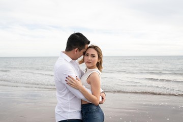 couple in love hugging on the beach