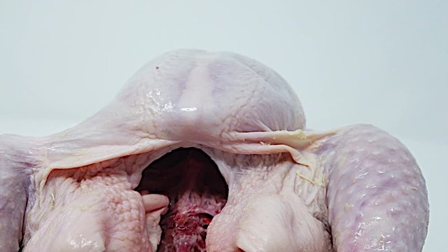Raw Uncooked Fresh Chicken Rotating,Ready To Be Cooked.