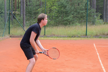 male tennis player watch the ball, get ready and waiting for a pass from the opponent