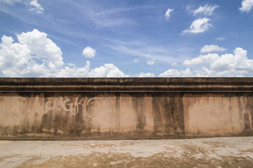  old grunge wall of taman sari water castle, Yogyakarta. against coulds and blue sky