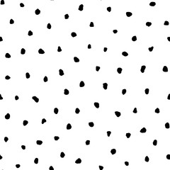Black grunge irregular polka dots vector seamless pattern on white background.