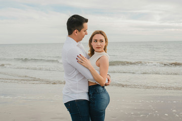 couple in love hugging on the beach