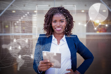 Woman holding tablet outside and virtual identification graphics. Young African American business...