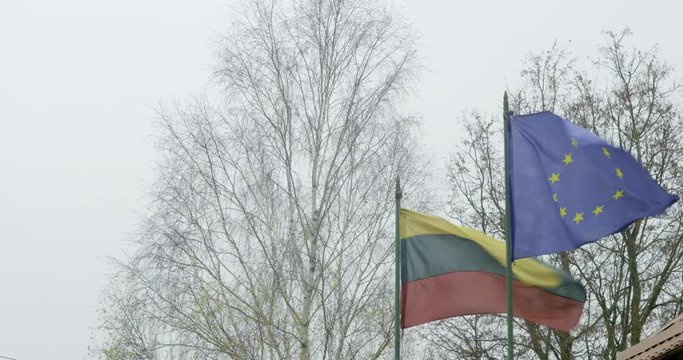 Lithuanian and European flags blowing in the wind.