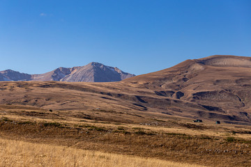 Autumn in the mountains, warm season, blue sky and nature says goodbye to summer.