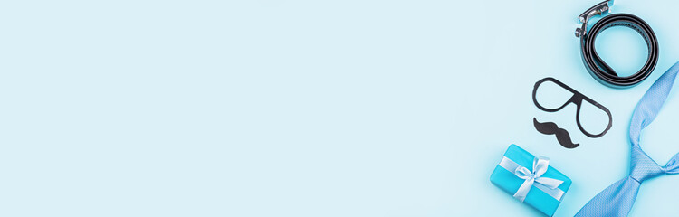 Happy Fathers Day background with gift and accessories on table top view. Flat lay style, overhead, mockup, template, copy space. Horizontal banner for web design