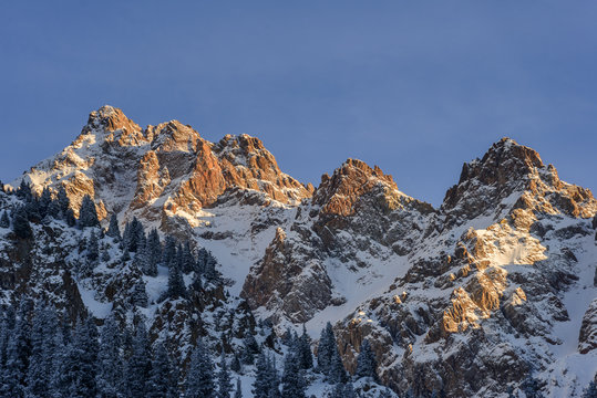 Peak of Abay at winter in the rays of the setting sun..Kazakhstan, the vicinity of Almaty