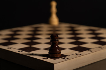 chess pieces on a chessboard. low key