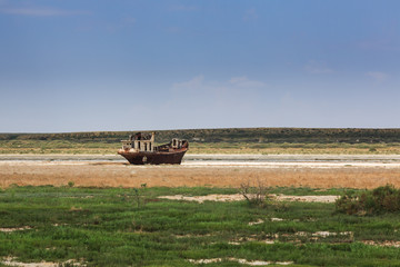 Old fishing schooner at the bottom of the dried Aral Sea