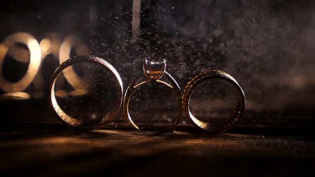 wedding rings with drops of water