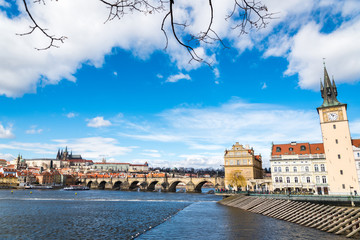 Naklejka premium The Prague castle with historic Charles Bridge and Vltava river under blue sky. Prague is a popular travel destination. Prague, Czech Republic