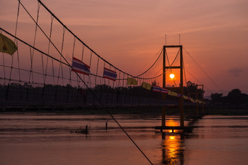Fototapeta na wymiar Taksin history bridge and sunset business travel of Thailand