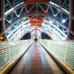 Background nightscape  image of tourist walkway and tourist standing on Peace bridge in Tbilisi.Georgia.25.03.2020 © Evaldas