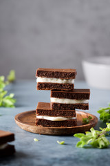 Chocolate cakes with cream. Home baking, coffee shop concept. Close up view