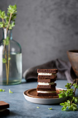 Chocolate cakes with cream. Home baking, coffee shop concept. Close up view