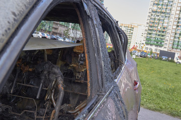 city burned cars after a fire in one of the city's districts