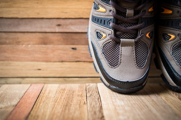 closeup of shoes on wooden background