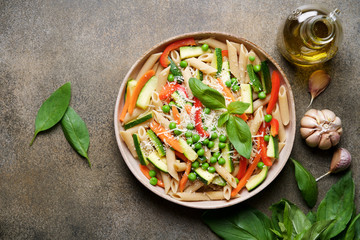 Pasta with zucchini, carrots, red bell pepper, garlic, parmesan and peas. Primavera Traditional Italian Vegetable Pasta