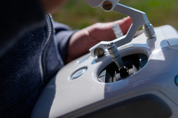 Drone remote control in hand man.Man operating of flying drone