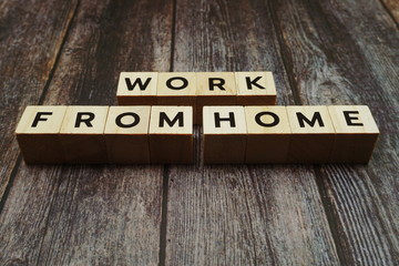 Work from Home alphabet letter on wooden background