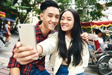 Close up selfie of young Vietnamese couple