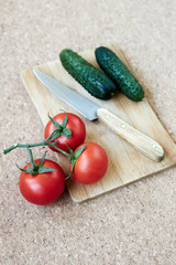 A bowl of fruit sitting on top of a cutting board