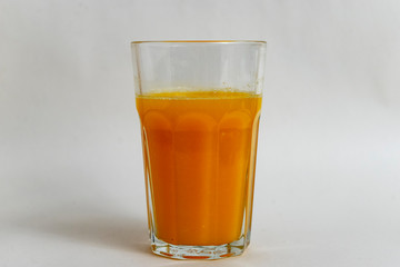 glass of fresh orange juice, white background
